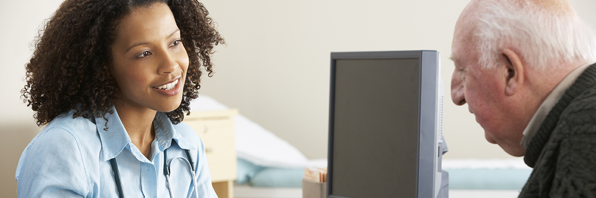 A GP talks with a patient