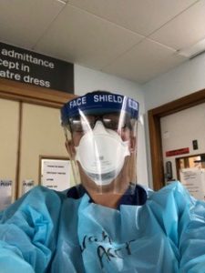 Nurse Sarah Quinton in uniform and PPE