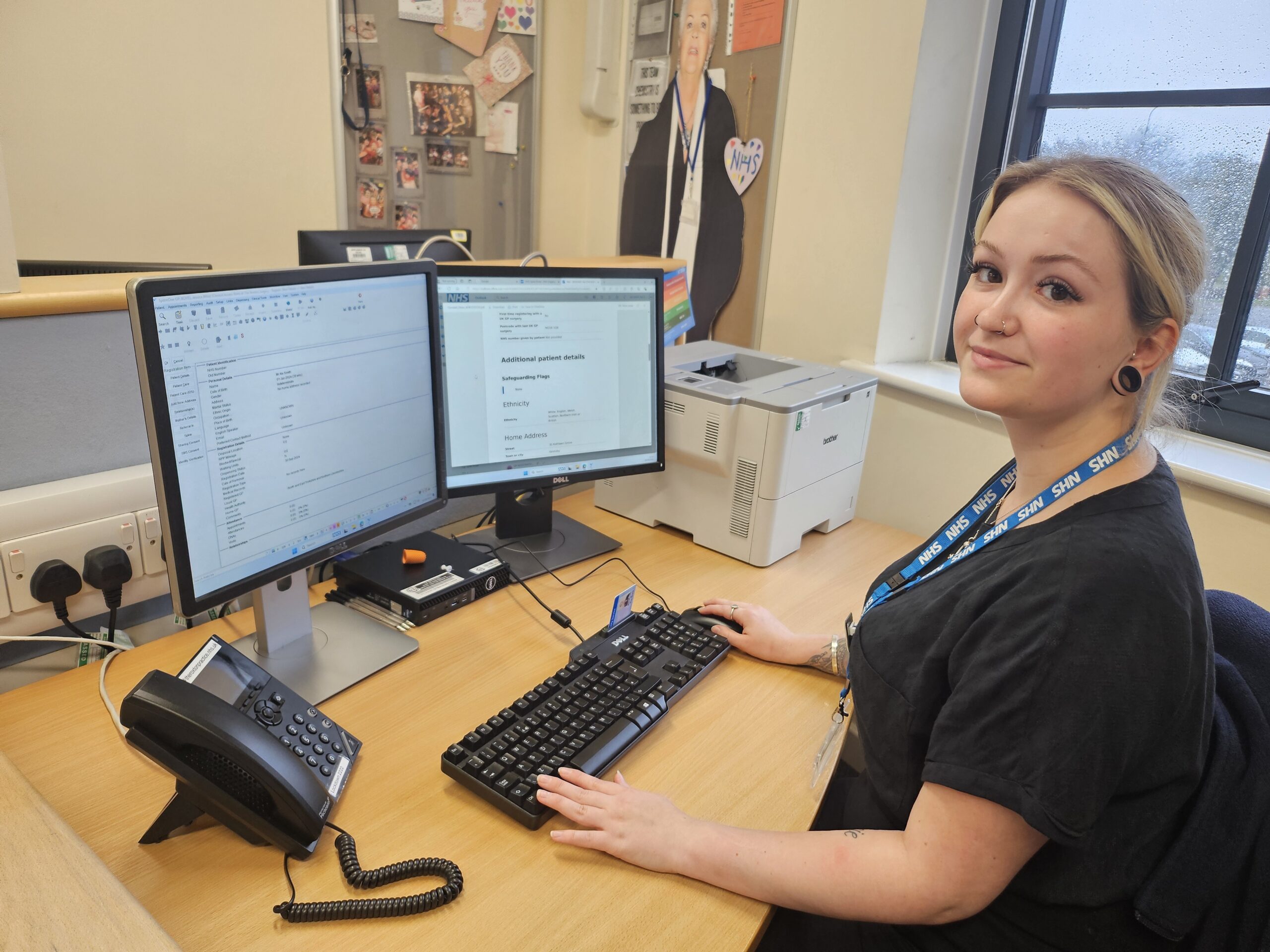 Image of Jess Boyes, supervisor at The Roxton Practice, sat at her desk while inputting registration-type information