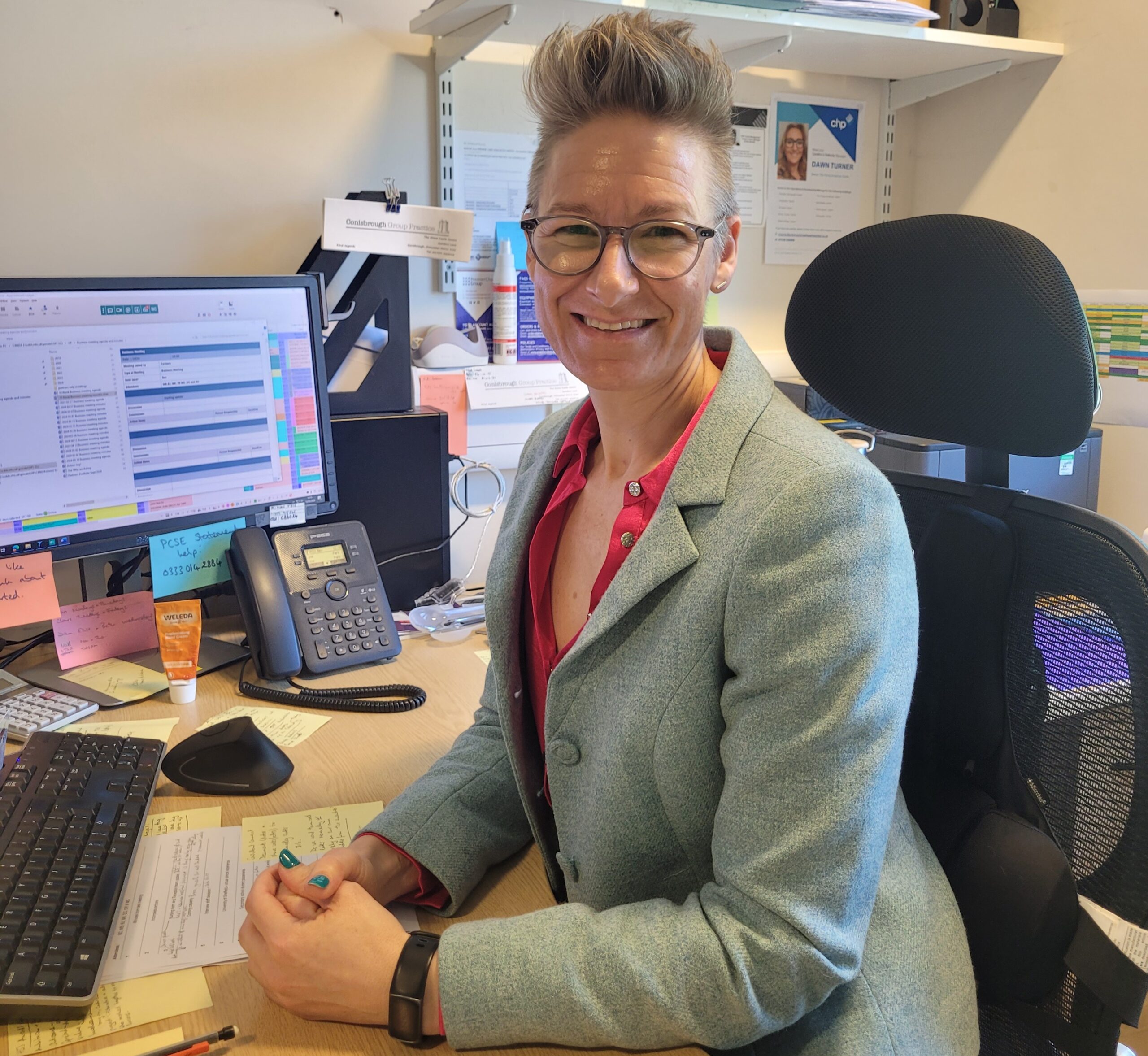 Business Manager Bex Cottey sits at her desk