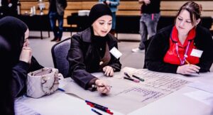 Suzie Ingram, Professional Standards and Advanced Practice Lead Nurse Spectrum CIC supporting a young person with a scenario based activity. 