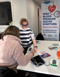 Amy Quickfall tests out a community blood pressure check
