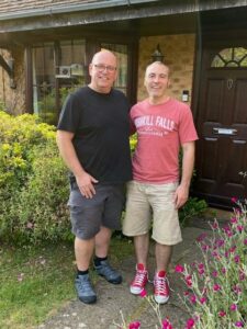 two men standing in the garden