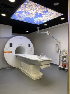 Photograph shows a piece of white equipment used as a scanner at the North Bristol Diagnostic Centre.