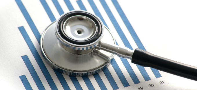 A stethoscope on a bar chart