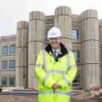 Sir Bruce Keogh at the construction site of the Cramlington Hospital