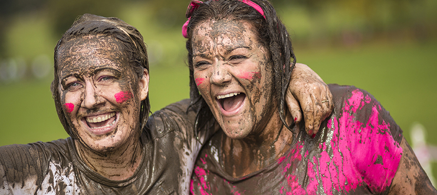 Two women taking part in a cancer fundraising event