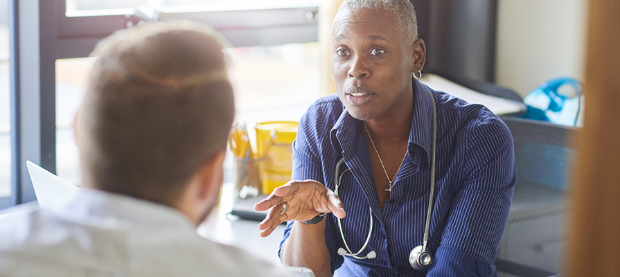 A doctor chats to a patient