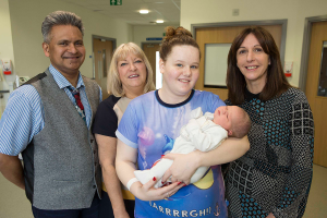 group of people and a baby