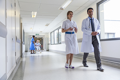 NHS staff walking down a corridor