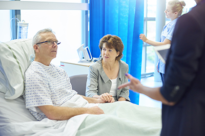 A couple talking to a hospital doctor