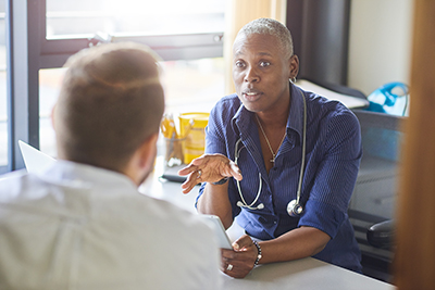 A doctor in discussion with a patient