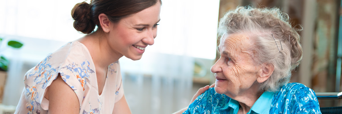 Elderly lady and her carer