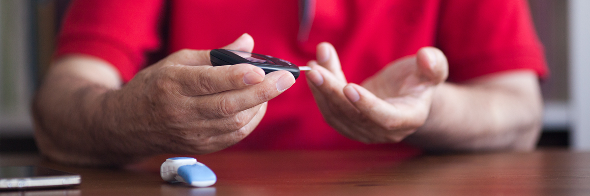 Man checking his blood sugar levels