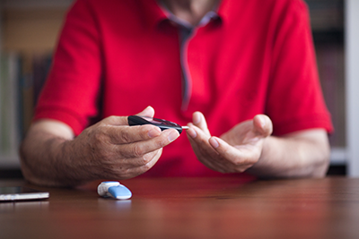 Man checking his blood sugar levels