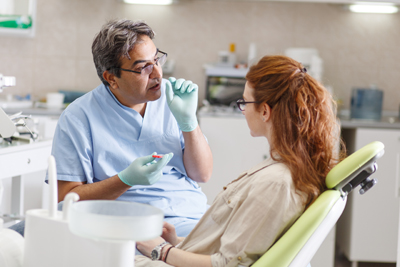 Dentist talking to a patient