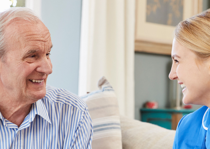 A nurse chats with a patient