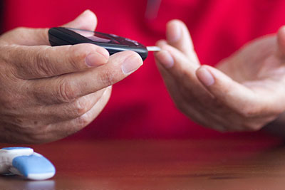 Man checking his blood sugar levels