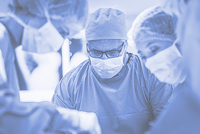 Surgeons operate on a patient