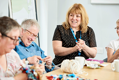 A group of patients learning to knit
