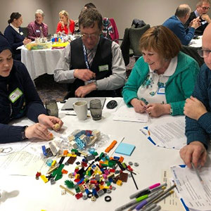 A group of service users sitting round a table