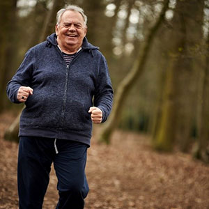 John running in a park