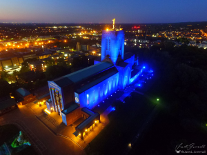 Aerial phoro of Guilford Cathedral lit up blue at night