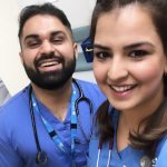 Two A&E staff smiling for a selfie