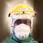 Person wearing personal protective equipment.