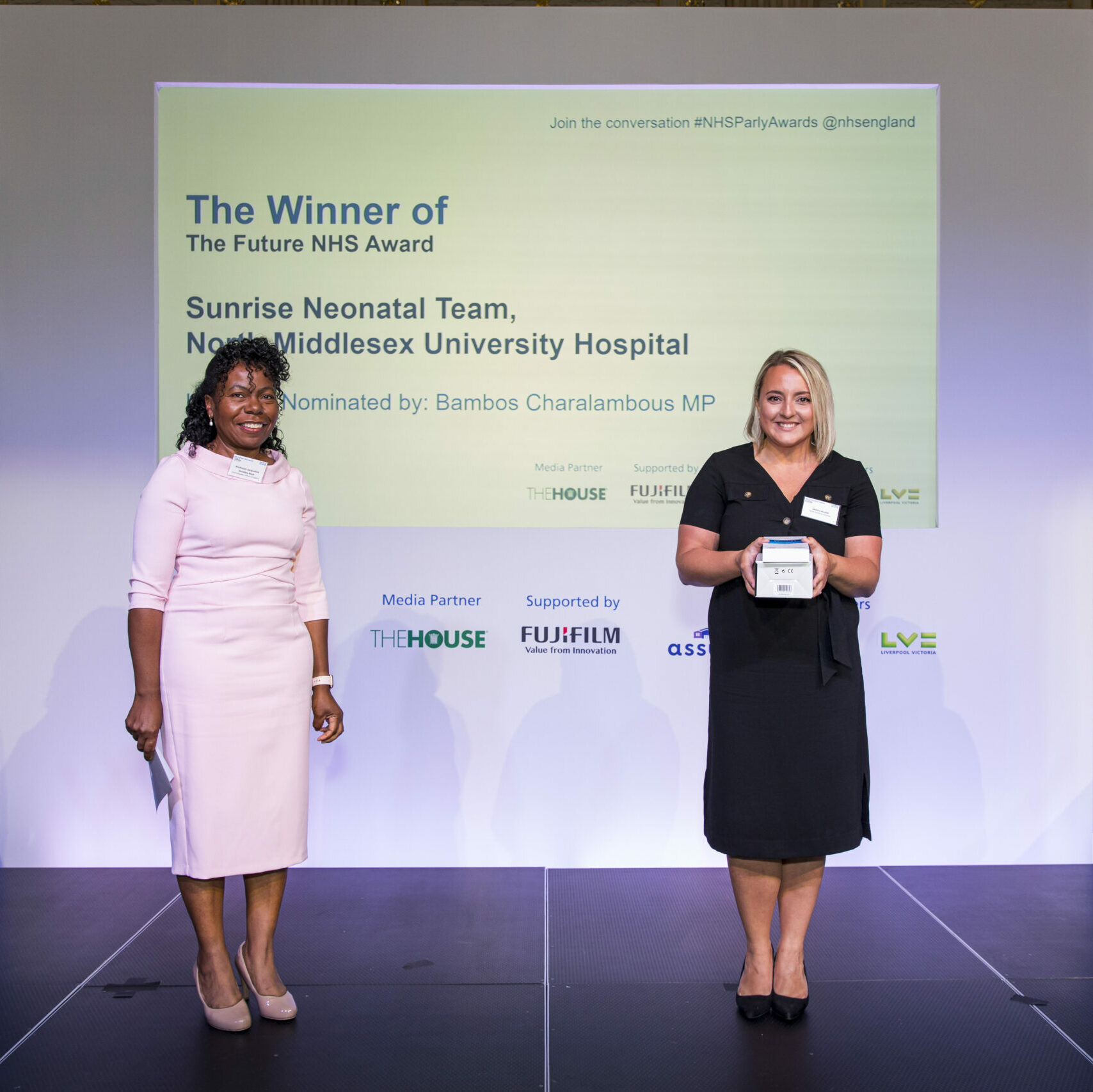 A member of the Sunrise Neonatal Team is stood on stage receiving The Future NHS Award