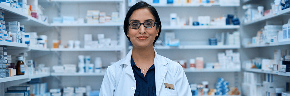 Pharmacist smiling in their pharmacy