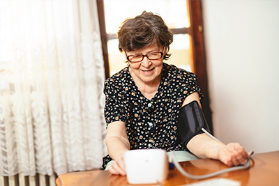 Woman taking her blood pressure