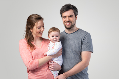 Young couple holding their child