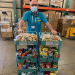 Photo of Andy Booth pushing food and drink trolleys