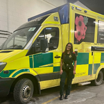 Photo of Grace Dickinson standing beside an ambulance