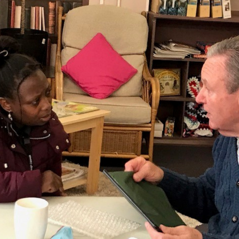 Photo of two people talking