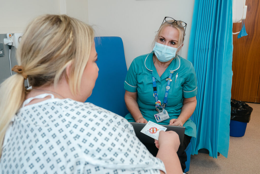 Tobacco Dependency Treatment Adviser talking to a patient