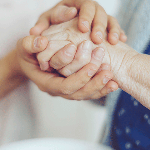 Close up image of hand clasped together