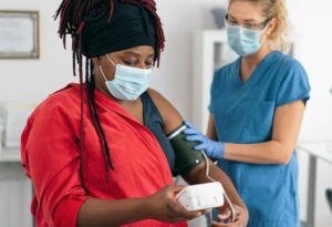 Photograph of a patient and a healthcare professional in a Lambeth GP practice