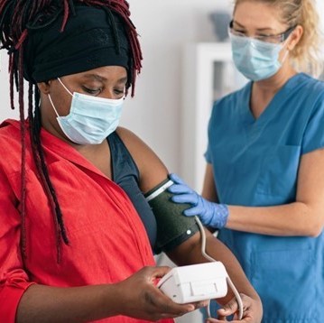 Photograph of a patient and a healthcare professional in a Lambeth GP practice