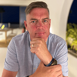 Head and shoulders shot of a man looking into the camera
