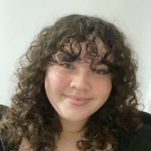 A profile photo of young board member Abigail.