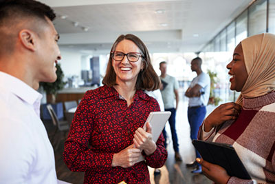 Three colleagues in conversation